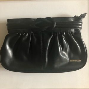 Black leather clutch with knot detail.Good condition.